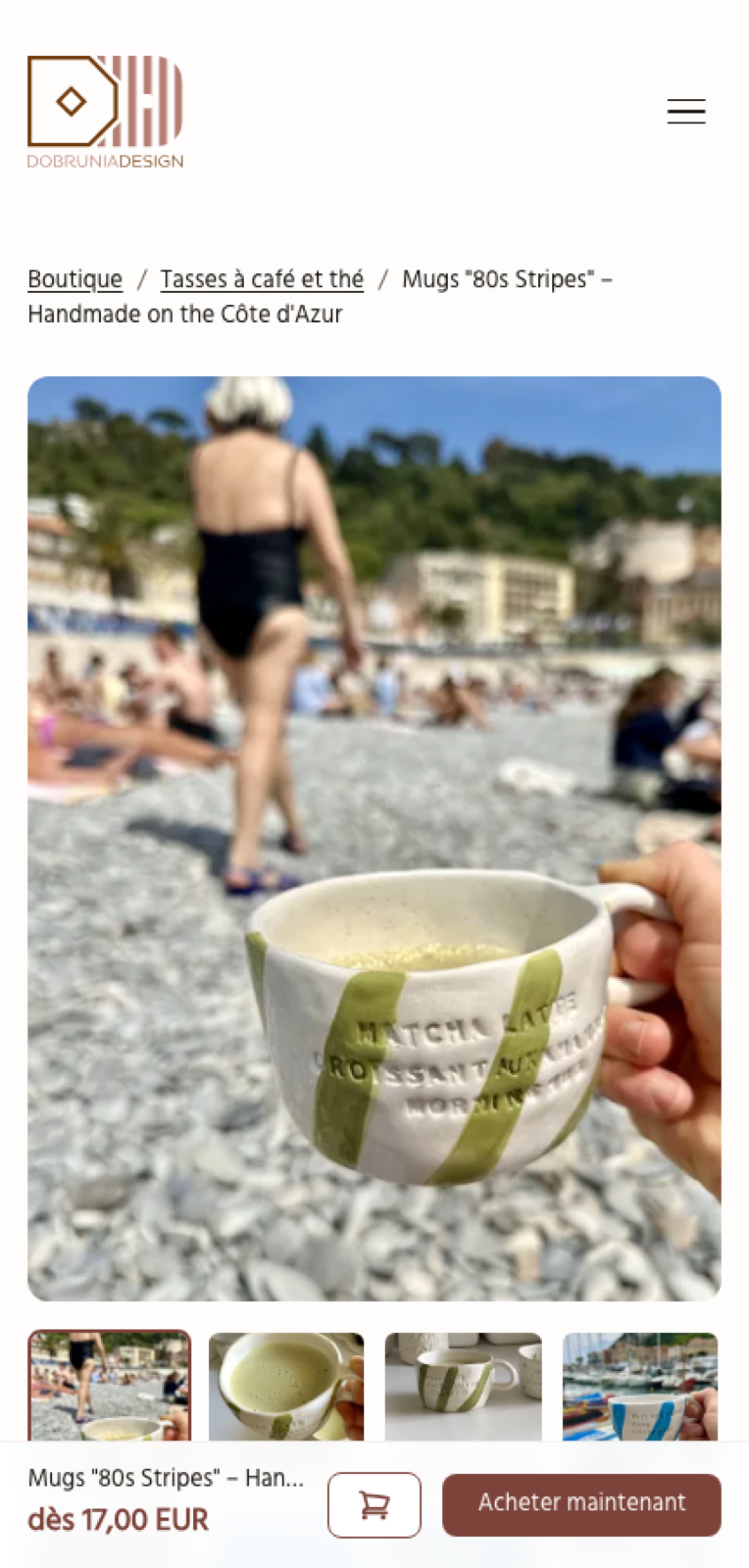 A product page on a phone: the breadcrumb, a photo of a striped handmade mug above a pebble beach, gallery thumbnails and, at the bottom, a fixed bar with the price from 17,00 EUR, a cart button and “Acheter maintenant”.